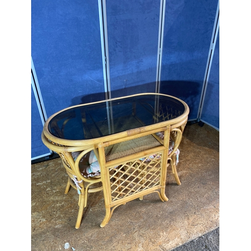 198 - Compact cane table and two chairs with glass top.

Dimensions - 39