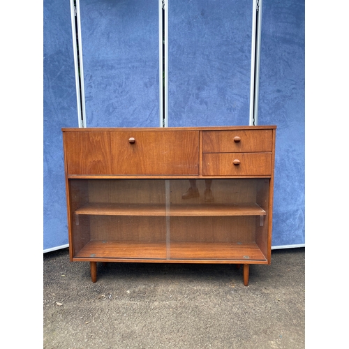 228 - Retro teak storage/ bookshelf unit with sliding glass doors and two drawers. 

Dimensions - 12