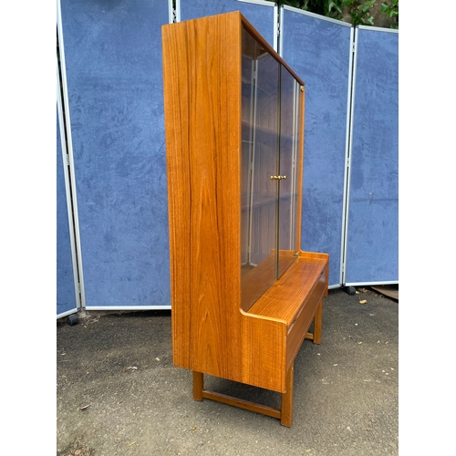 236 - Vintage Turnidge teak glass front display cabinet with one drawer.

Dimensions - 16