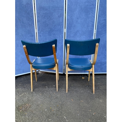 254 - A pair of blue leather Benchairs Stoe chairs