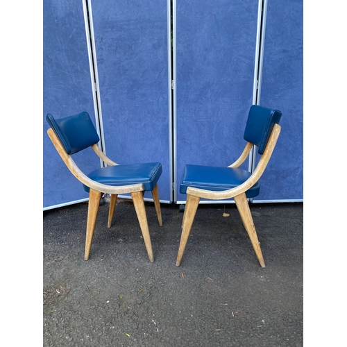 254 - A pair of blue leather Benchairs Stoe chairs