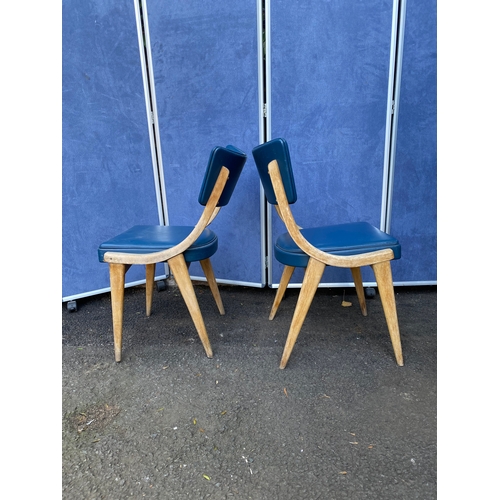 254 - A pair of blue leather Benchairs Stoe chairs