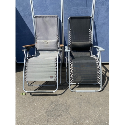 279 - A pair of recliner foldable sun loungers. One made by lafuma