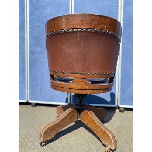 284 - Antique oak and leather swivel desk office chair.