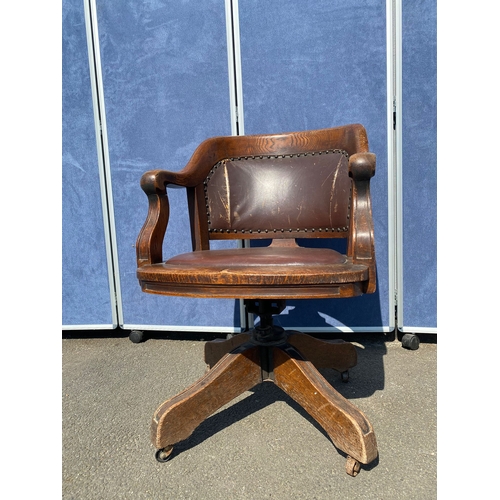 284 - Antique oak and leather swivel desk office chair.