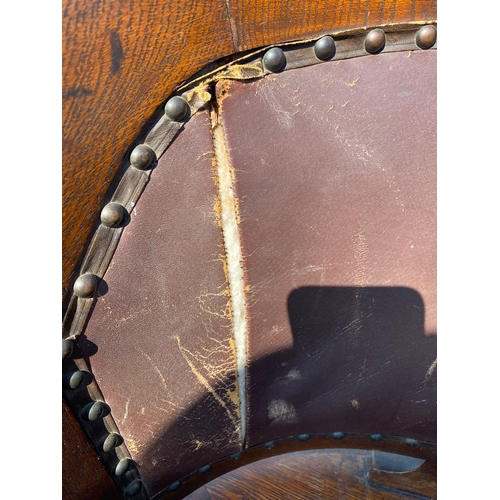 284 - Antique oak and leather swivel desk office chair.