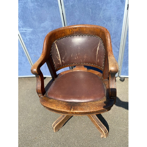 284 - Antique oak and leather swivel desk office chair.