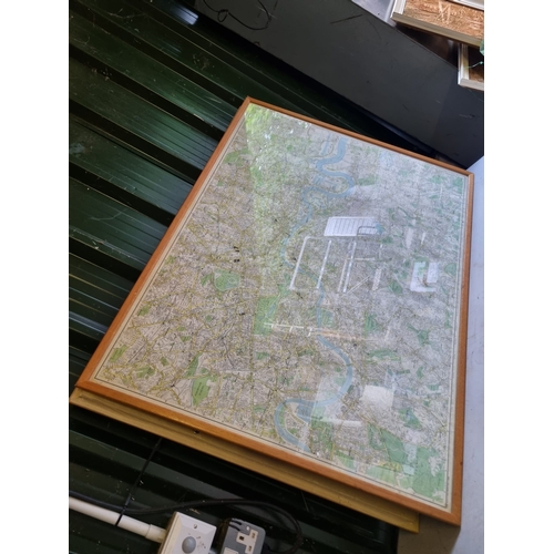 317 - A large framed map of surrounding London area.