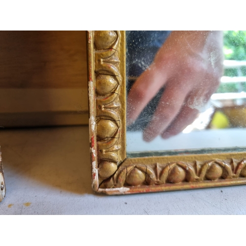 370 - A pair of narrow gilt frames mirrors.