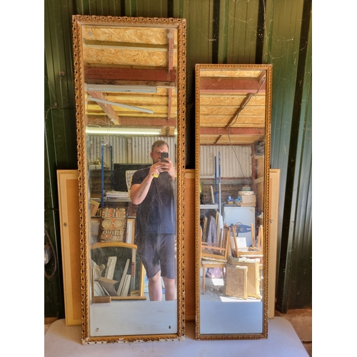 370 - A pair of narrow gilt frames mirrors.