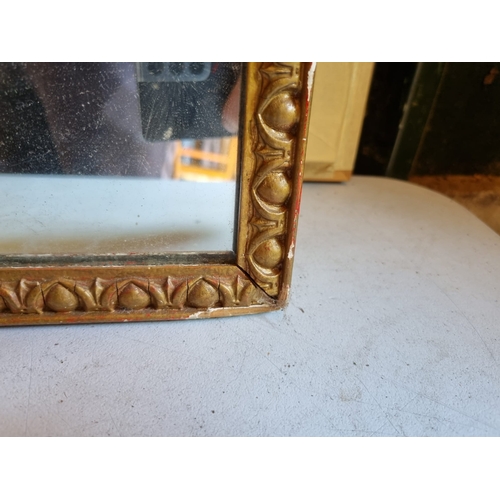 370 - A pair of narrow gilt frames mirrors.