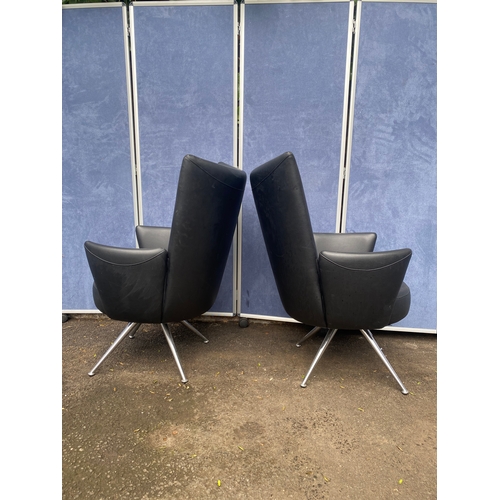 389 - A pair of Italian leather arm chairs
chairs with chrome feet.

Dimensions - 28