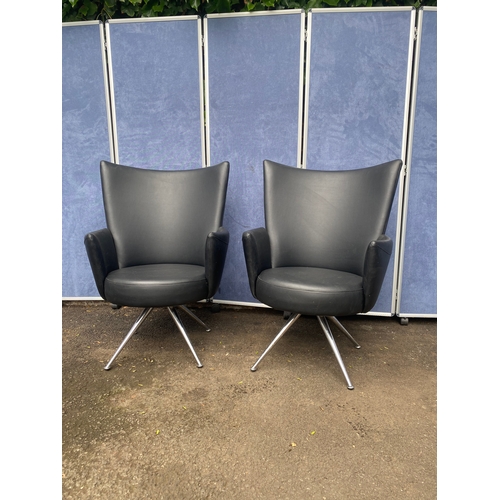 389 - A pair of Italian leather arm chairs
chairs with chrome feet.

Dimensions - 28