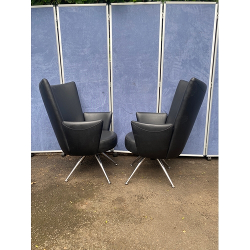 389 - A pair of Italian leather arm chairs
chairs with chrome feet.

Dimensions - 28