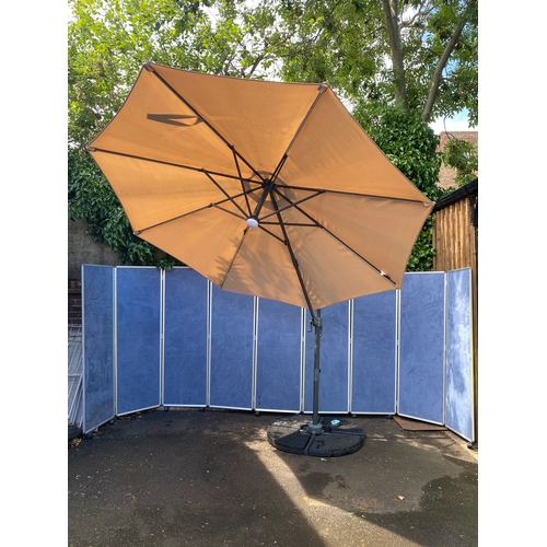 408 - Large parasol and stand with weights. 

See images for dimensions.