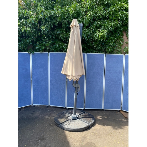 408 - Large parasol and stand with weights. 

See images for dimensions.