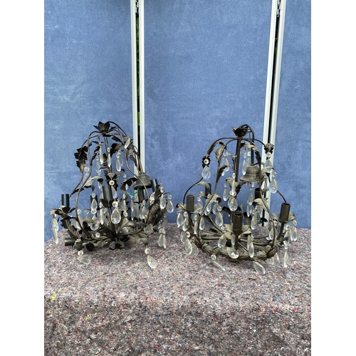 423 - A pair of Vintage metal chandeliers in black.