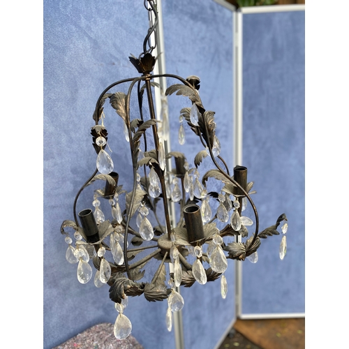 423 - A pair of Vintage metal chandeliers in black.