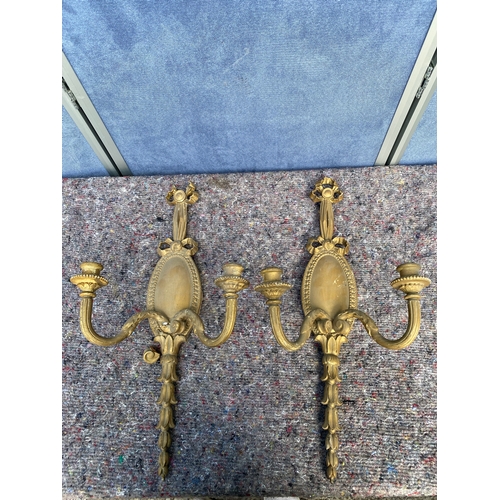 427 - A pair of vintage guilt painted wall hanging candle stick holders.