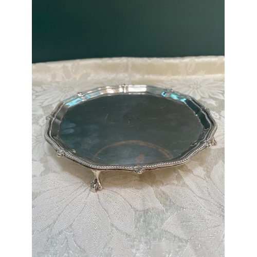 37 - A lovely Edwardian Sterling Silver Salver Raised on Claw & Ball Feet , Monogrammed to the centre. Sh... 