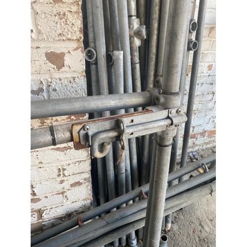 283 - A collection of scaffolding with two bolt lock doors