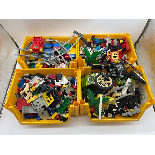 77 - Four boxes of vintage Lego pieces