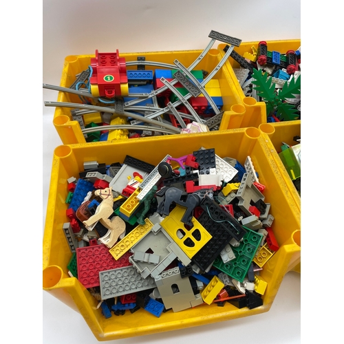 77 - Four boxes of vintage Lego pieces