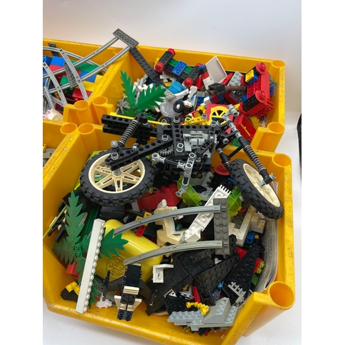 77 - Four boxes of vintage Lego pieces