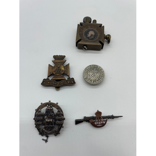 73 - Lot of Four Period Military Cap Badges + trench art lighter from same period 
The Wiltshire Regiment... 