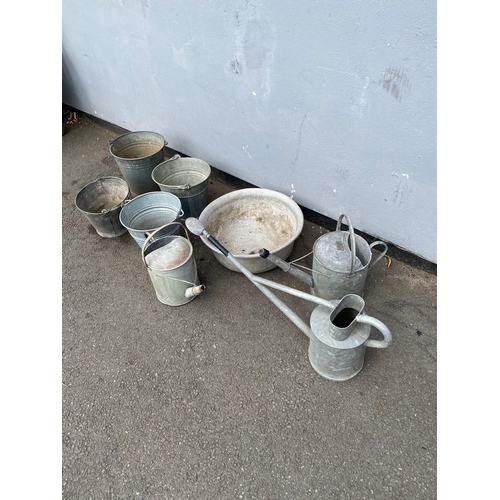 311 - A selection of galvanised watering cans and buckets