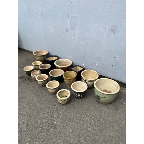 312 - A large selection of ceramic garden pots