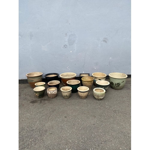 312 - A large selection of ceramic garden pots