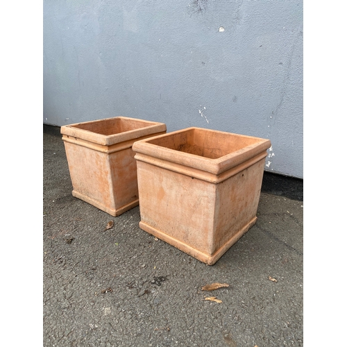 313 - A pair of light terracotta cube planting pots