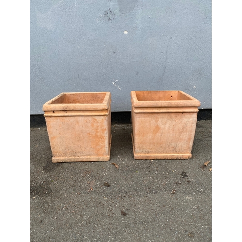 313 - A pair of light terracotta cube planting pots