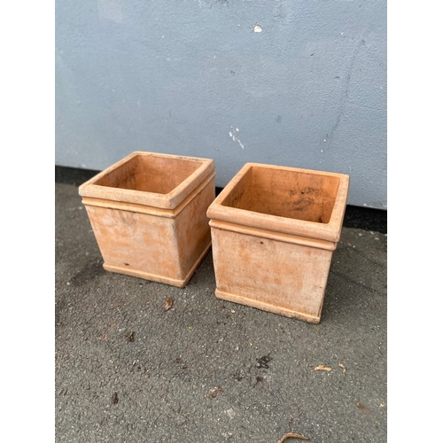 313 - A pair of light terracotta cube planting pots