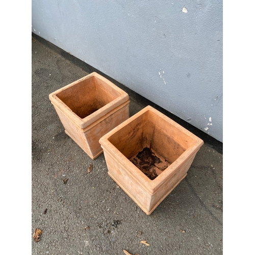 313 - A pair of light terracotta cube planting pots