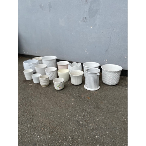 324 - A large selection of white cache pots