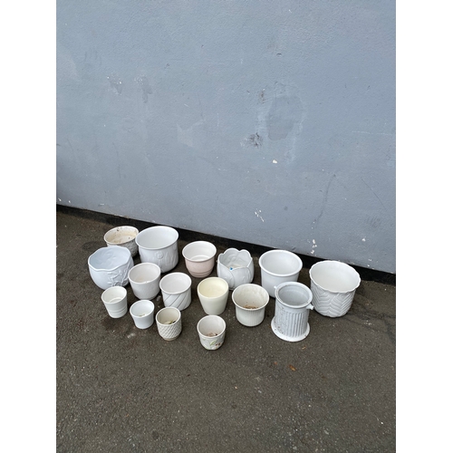 324 - A large selection of white cache pots