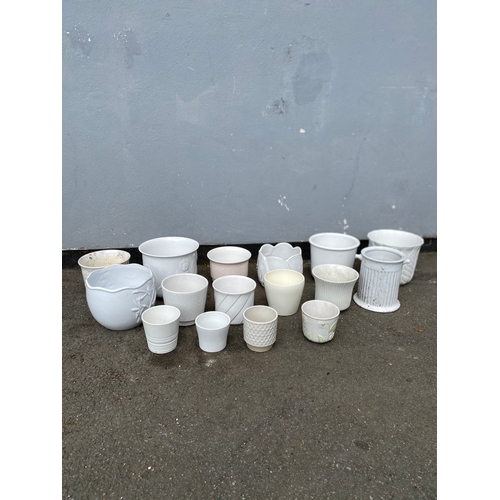 324 - A large selection of white cache pots