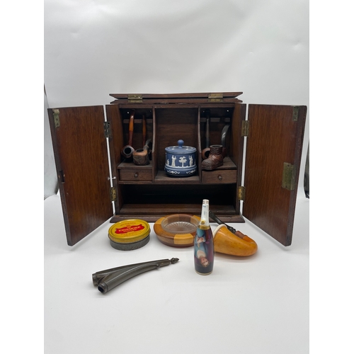 62 - Vintage Pipe Smokers Cabinet with collection of pipes and ephemera