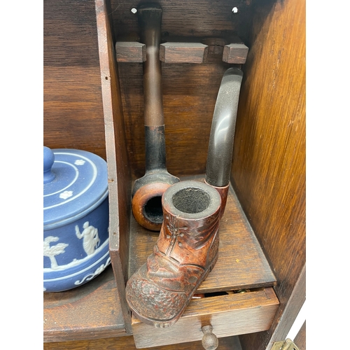 62 - Vintage Pipe Smokers Cabinet with collection of pipes and ephemera