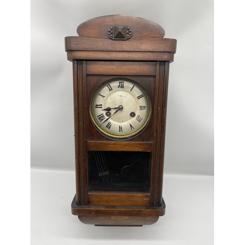 56 - Antique Oak cased wall clock