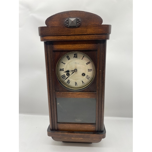 56 - Antique Oak cased wall clock