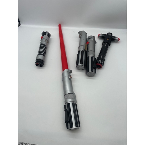 44 - Lot of 5 Children's Star Wars lightsabers c2000