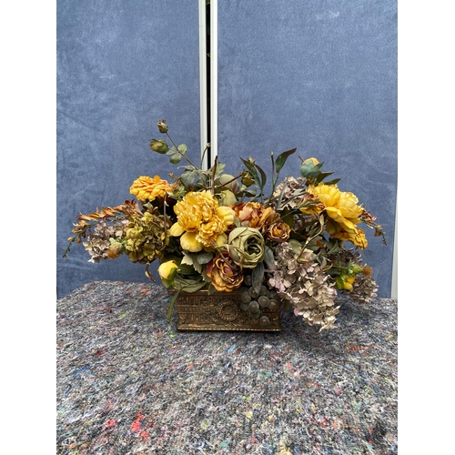 85 - A trio of artificial flower display pieces.