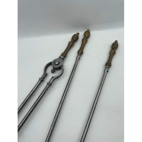 79 - Set of three antique Fireplace Tools