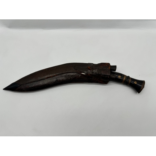 94 - A Vintage Indian Kukri Knife, with inlaid handle, leather scabbard with both side knives included - ... 