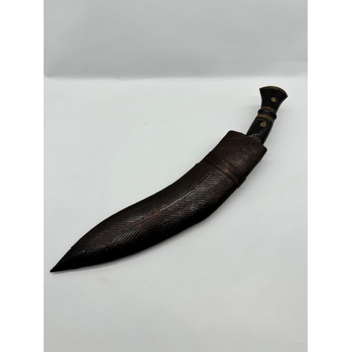 94 - A Vintage Indian Kukri Knife, with inlaid handle, leather scabbard with both side knives included - ... 