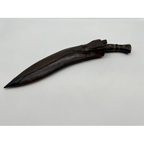 94 - A Vintage Indian Kukri Knife, with inlaid handle, leather scabbard with both side knives included - ... 