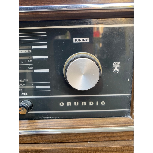 153 - Vintage Grundig stereo console.

Dimensions - 32